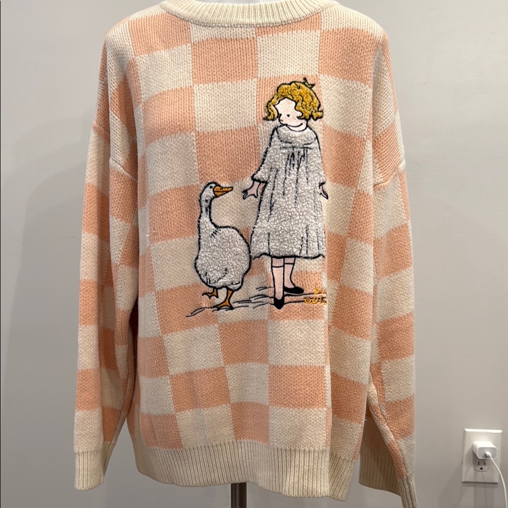 Peach Checkered Sweater with Girl and Goose Design